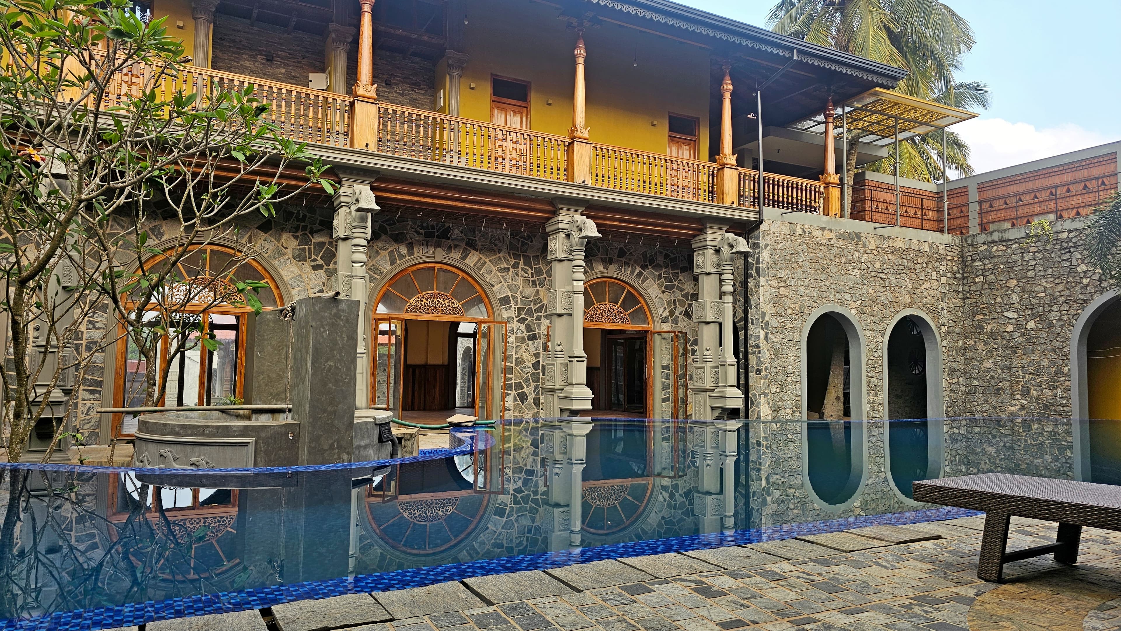 Pool area with heritage balcony and pillars